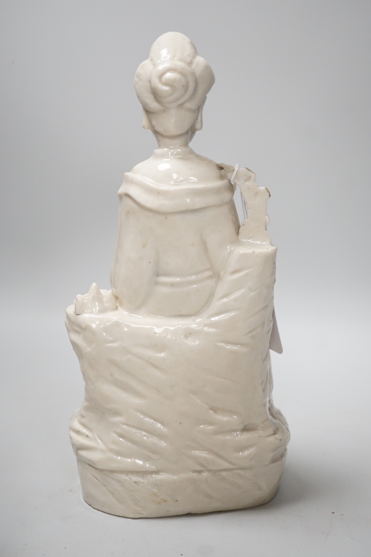 A Chinese enamelled blanc de chine figure of Guanyin, together with three other figures. 28cm tall